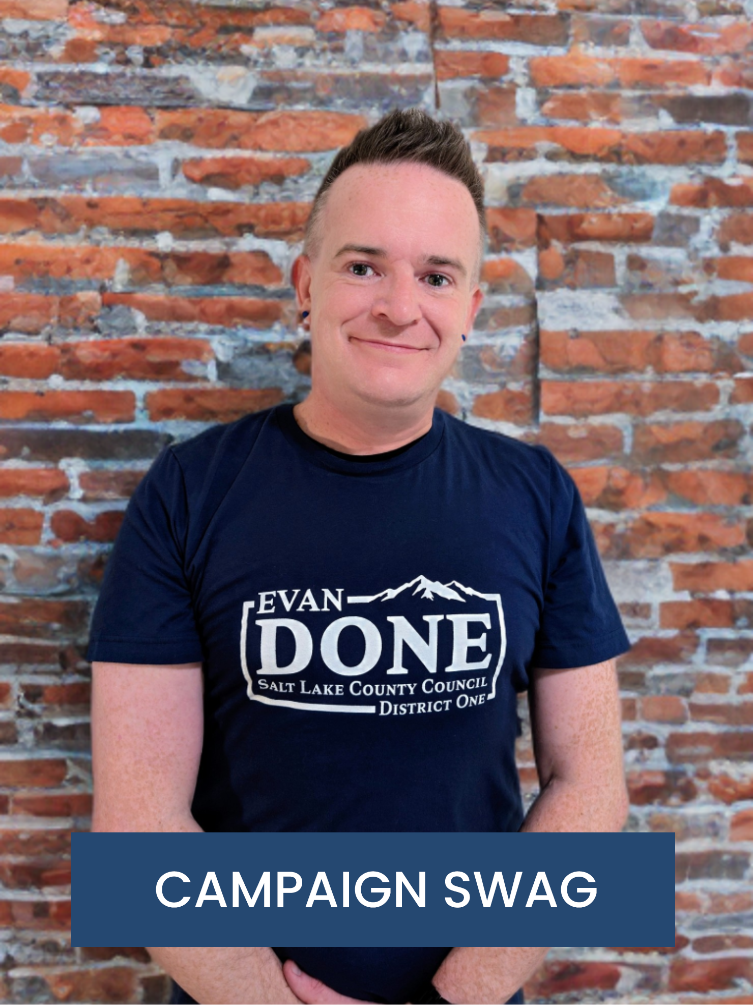 https://www.evandone.com/wp-content/uploads/2025/05/Evan-Done-Campaign-Shirt-w-Button.png